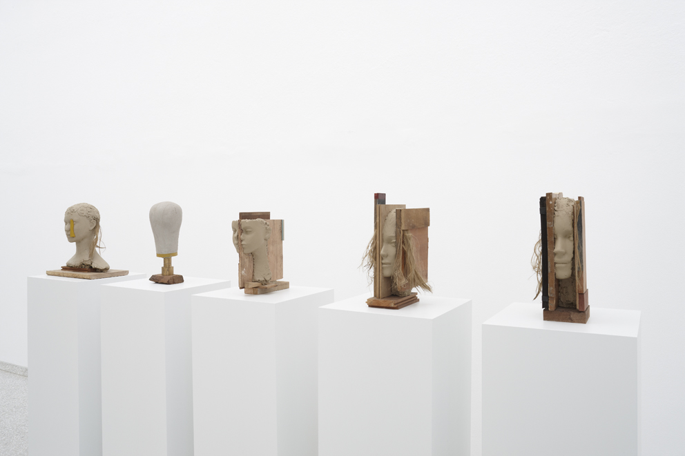 Mark Manders, Girl with Yellow Vertical (2013); Head Study (2012-2013); Head Study (2012-2013); Girl Study (2013); Girl Study (2013) / wood, painted wood, painted epoxy, brass, painted canvas, painted wig / 16.5 x 16 x 41 cm Courtesy of Zeno X Gallery and Tanya Bonakdar Gallery