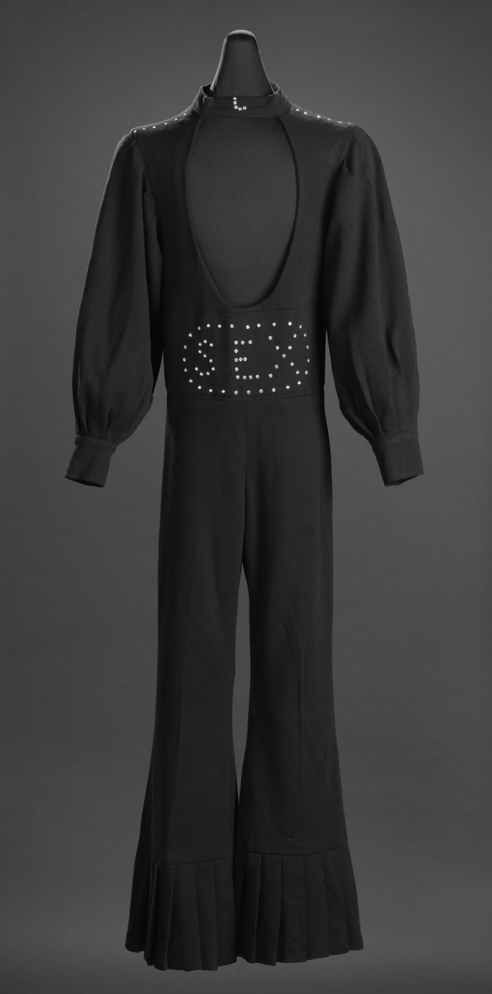 Black "Sex" jumpsuit owned by James Brown 1970-1989. Collection of the Smithsonian National Museum of African American History and Culture.