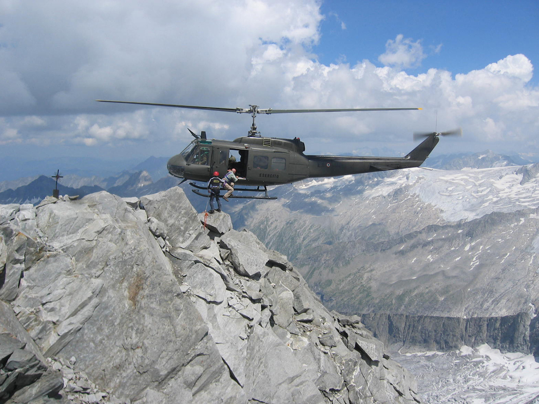 Members of the team working on the maintenance of markers on the state border and the determination of their coordinates using GPS technology. Gran Mesule peak (3749 m), Italian-Austrian border. Photo by Simone Bartolini, July 2006.