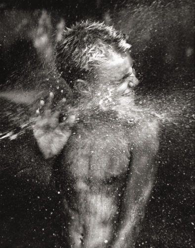 Spidey. Water Fight, Montauk, N.Y., 2002. © Michael Dweck.