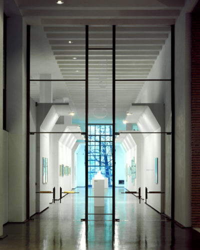 Fitting out of the entrance area of the Palazzo dell’Arte, Triennale, Milan, 1994-95. The large glass door leading to the gallery. Photo: Francesco Radino.  