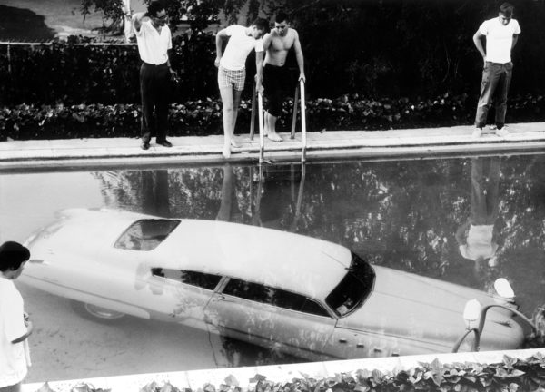 Car parked in swimming pool, Beverly Hills, California, May 4, 1961. © Keystone and Getty Images.